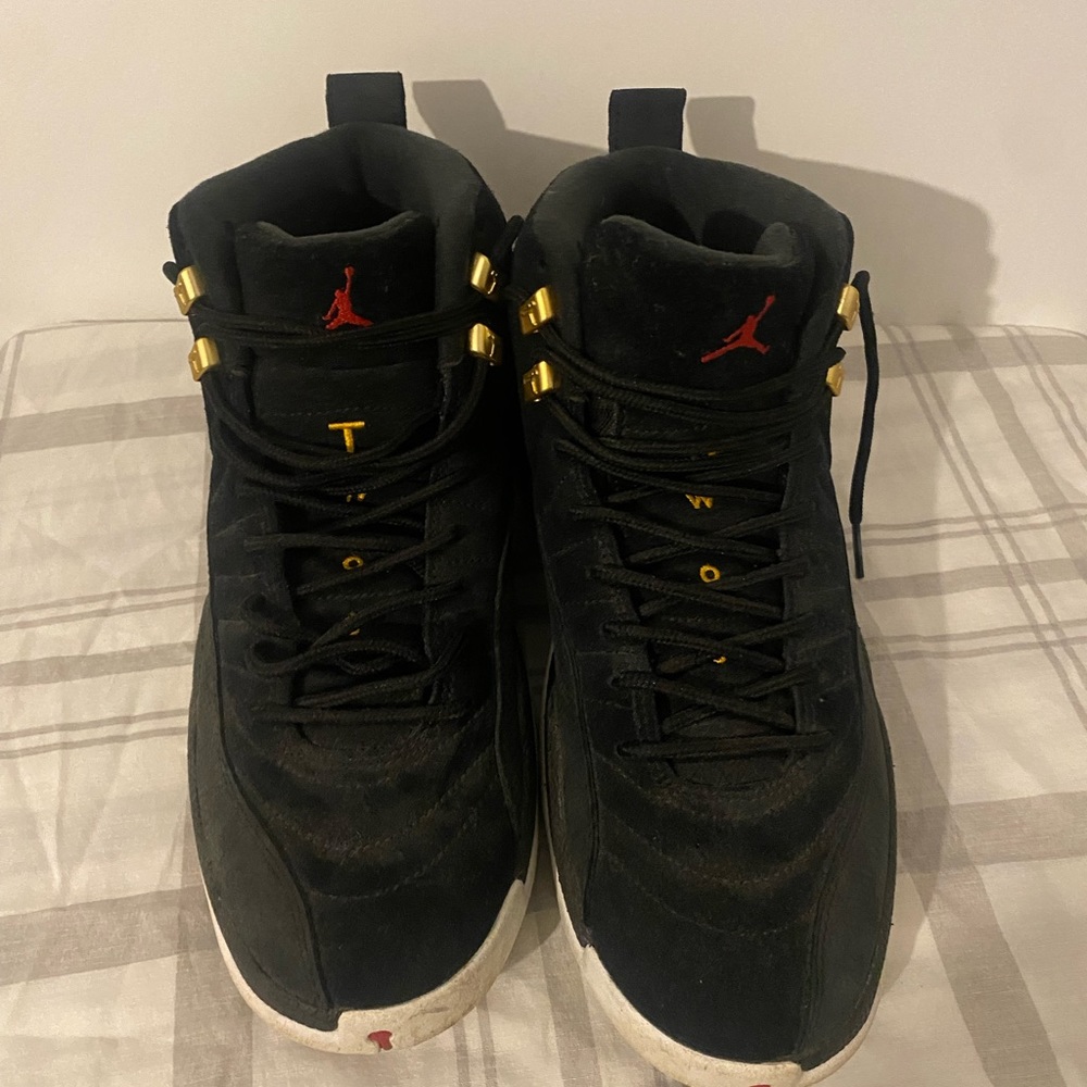 Black and white shoe Jordan 12s